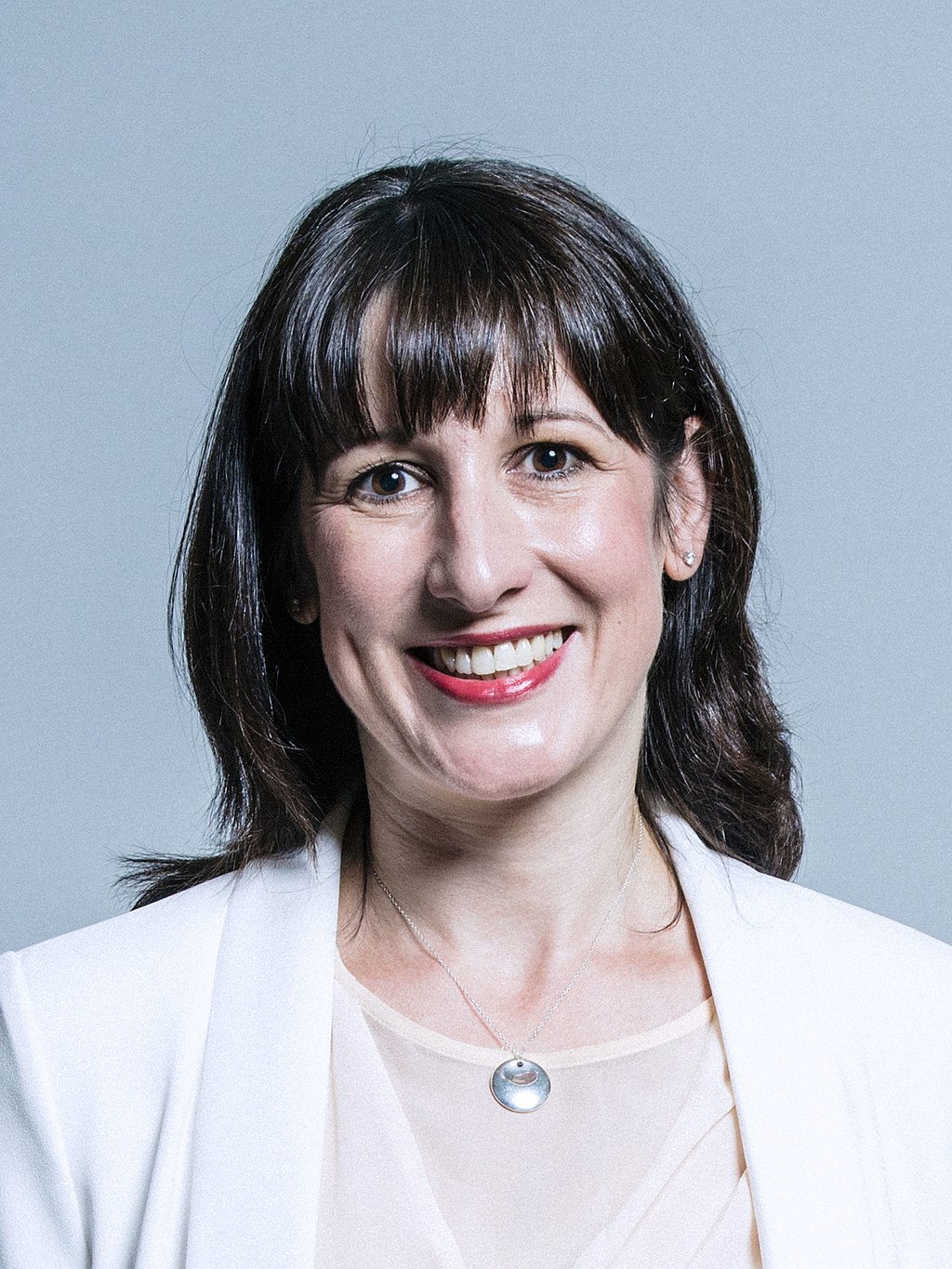 Official portrait of Rachel Reeves looking at the camera and smiling