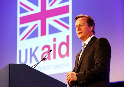David Cameron speaking at a podium