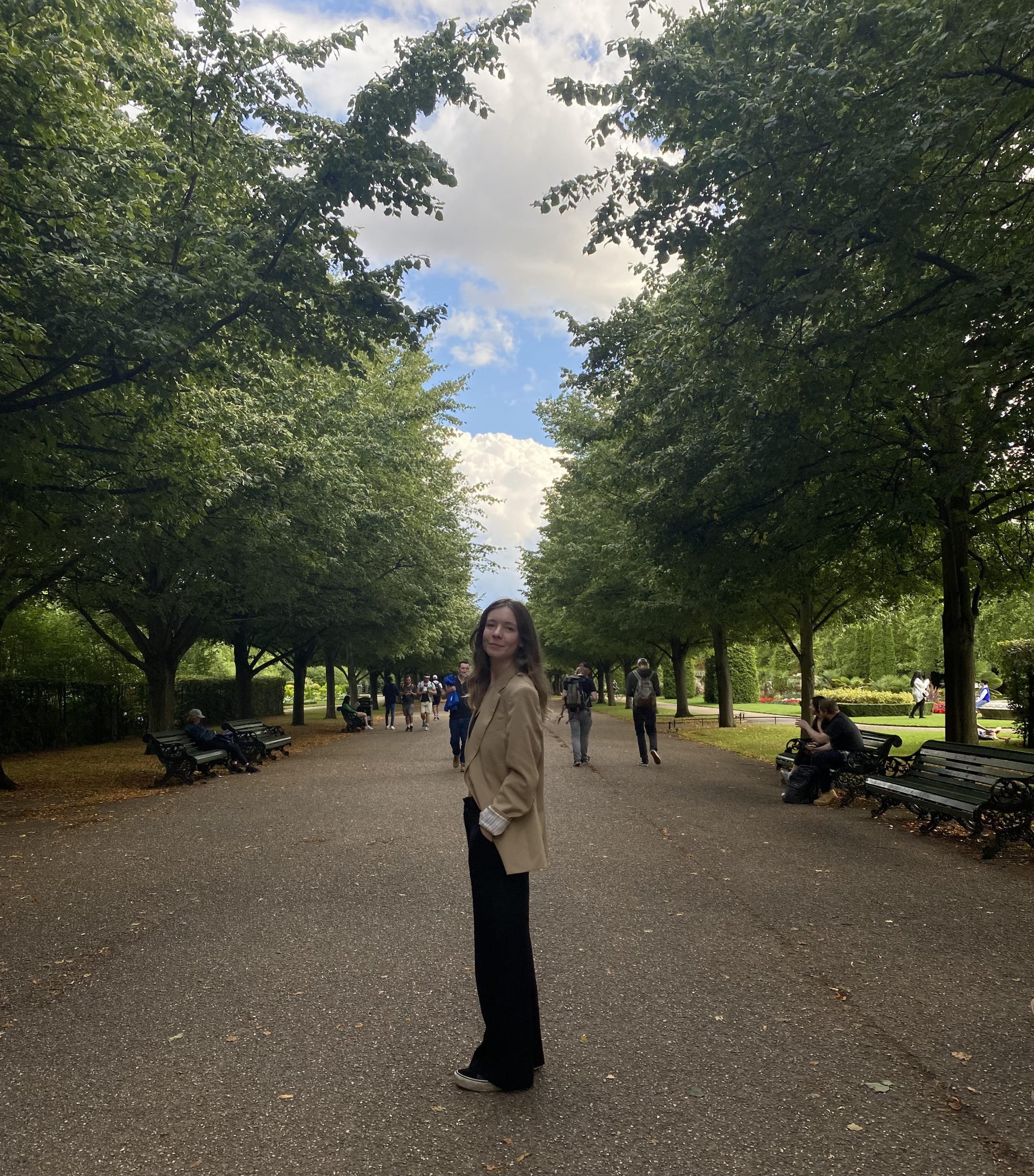 Image of deputy-editor in chief standing in a park